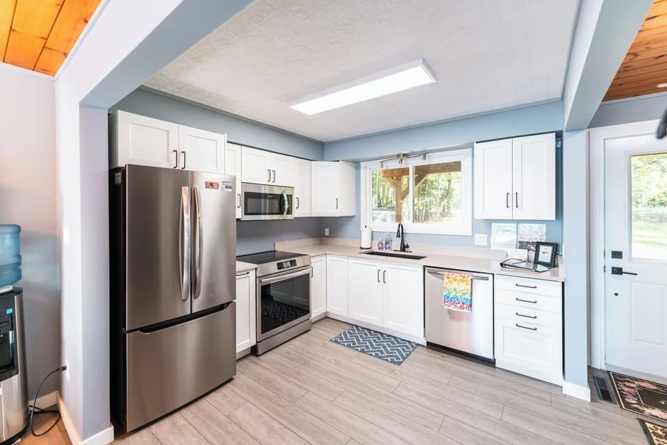 Our kitchen has brand new appliances and induction cookstove. 