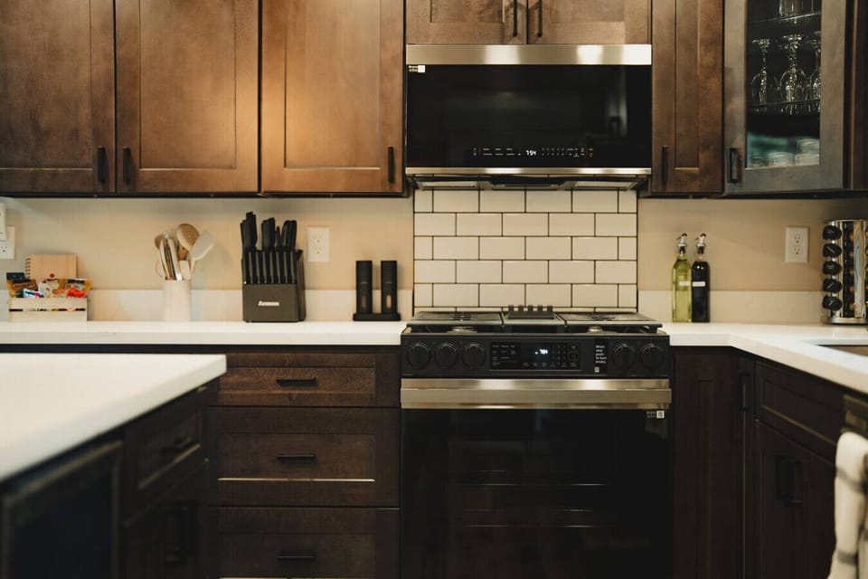 Beautiful Kitchen w/Quartz countertops - Brand-new appliances:  Gas Stove, Oven, Microwave, Wine Fridge, Fullsize Refrigerator/Freezer, & Dishwasher!