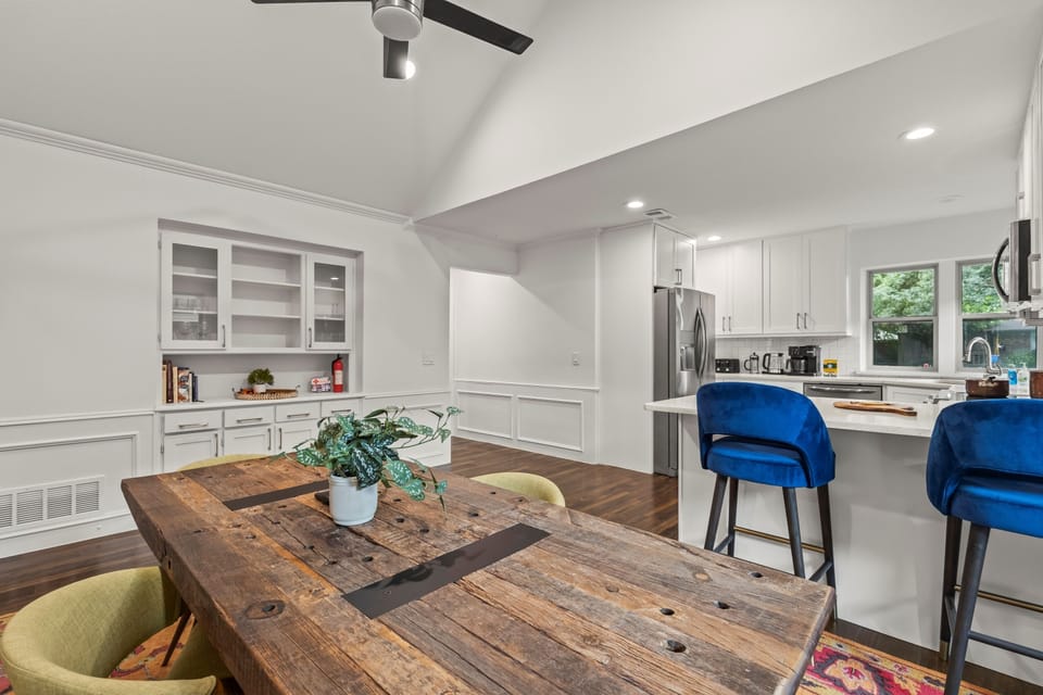 Our home features an open floor plan, perfect for group gatherings. This cozy sitting area provides a great spot to relax and chat while staying connected to the kitchen and dining areas.