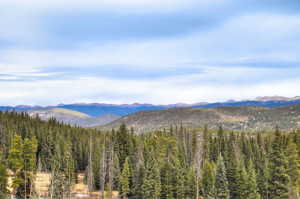 Panoramic views of the Ten Mile Range's endless evergreens from your balcony
