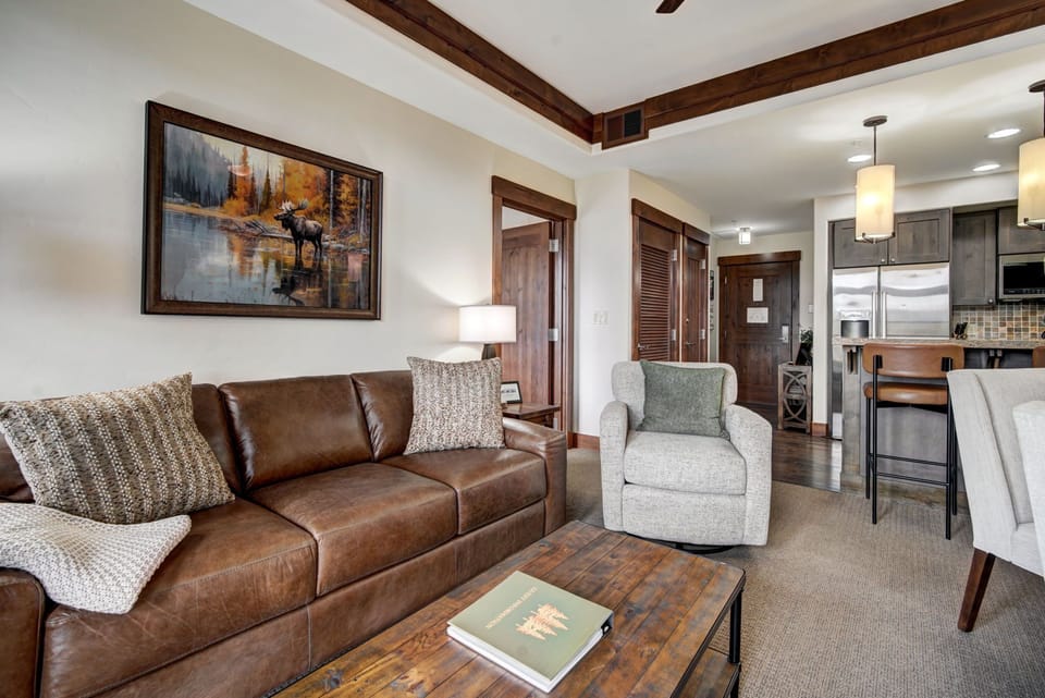 Inviting leather sofa and swivel chair - a stylish spot to unwind by the fire