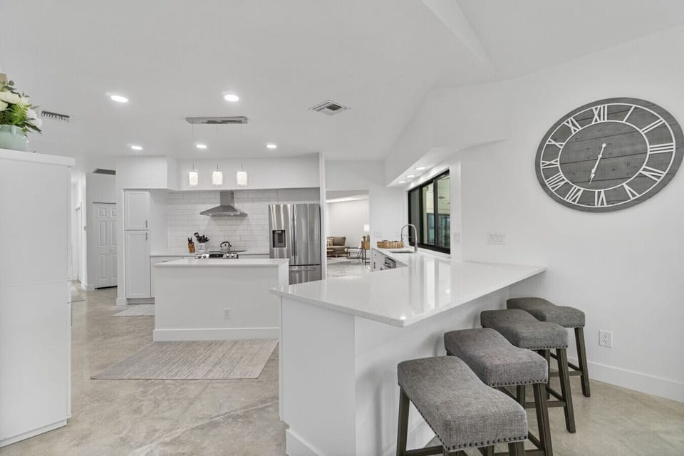 Sleek kitchen bar seating makes casual breakfasts fun and effortless.