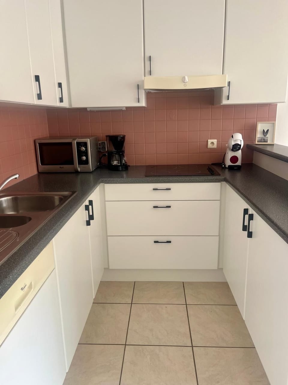 Cook with ease in this modern kitchen with all essentials provided.