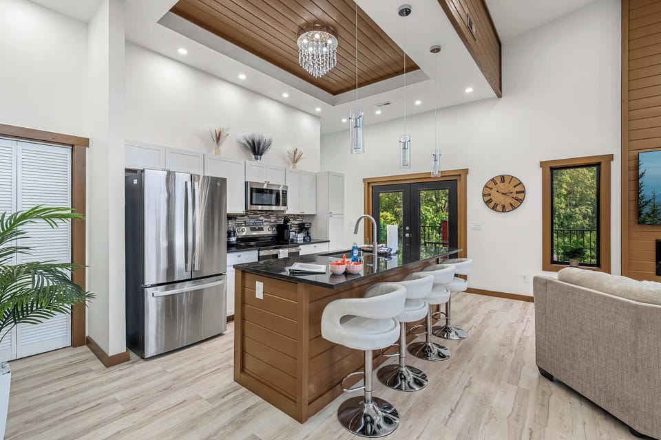 Open Concept Kitchen with Granite Countertops and Stainless Steel Appliances