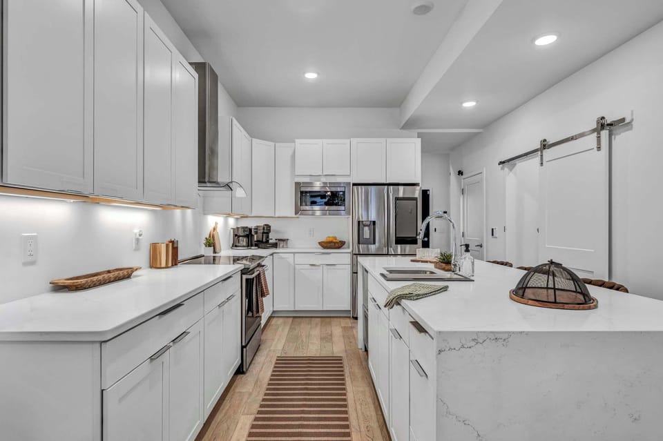 This open-concept kitchen combines modern luxury with everyday comfort, creating the perfect space for cooking and connecting.