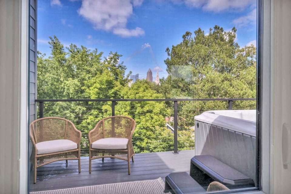 Cozy balcony seating beside the jacuzzi creating the perfect spot for quiet mornings and sunset unwinding.