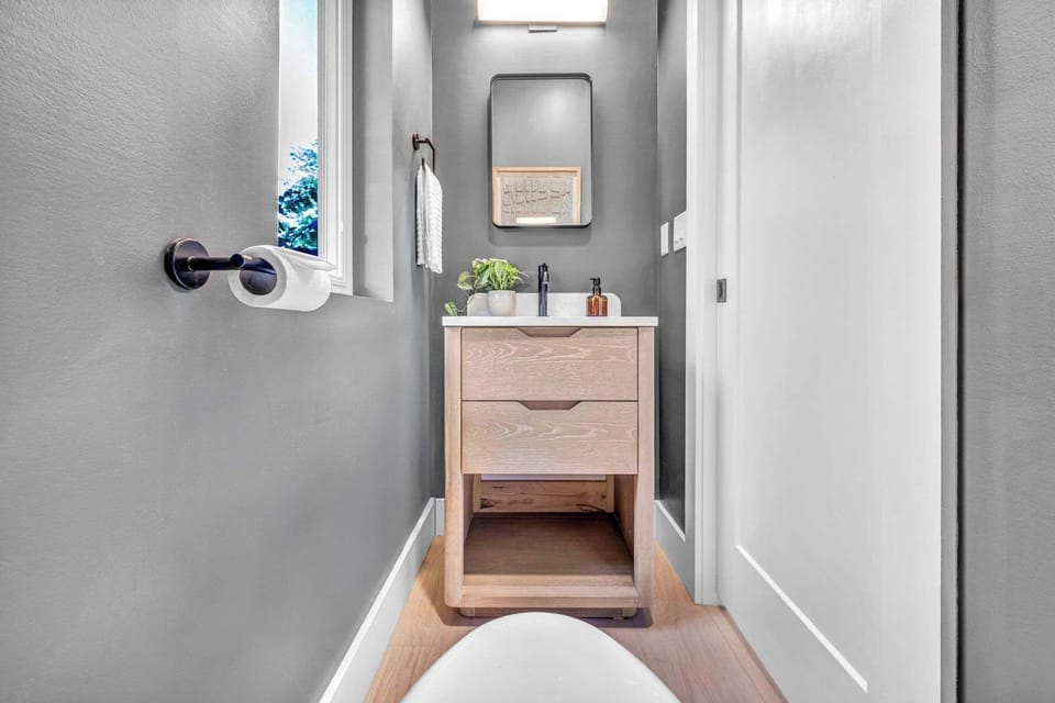 Sleek modern powder room with minimalist design creating a clean and refreshing space for everyday comfort.