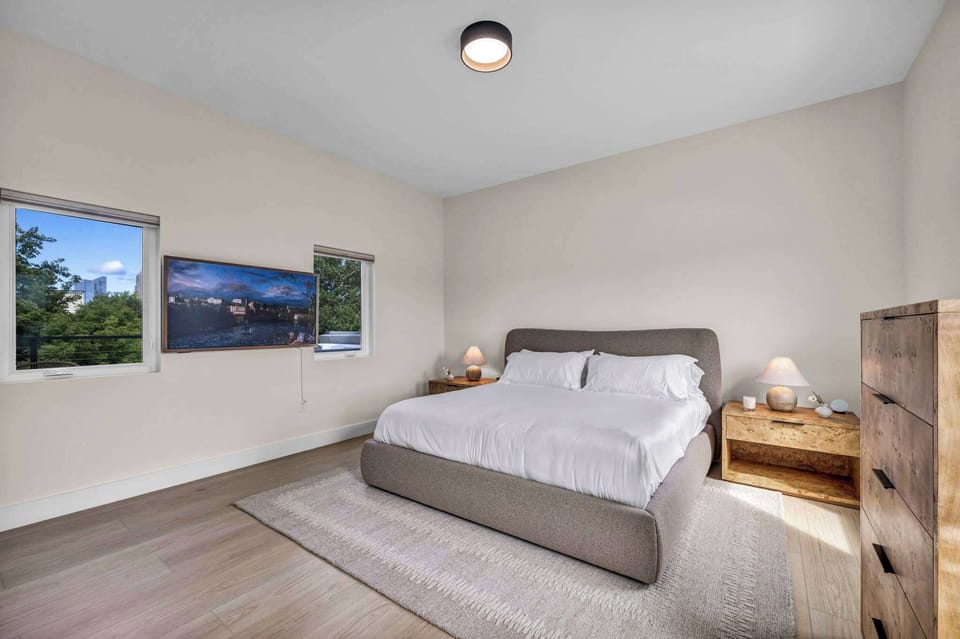 Elegant and minimalist design with soft linens, warm accents, and natural light creates the perfect retreat for comfort and style.