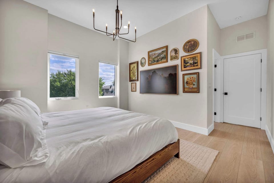 Minimalist bedroom with soft natural light and modern finishes designed for peaceful and restful nights.