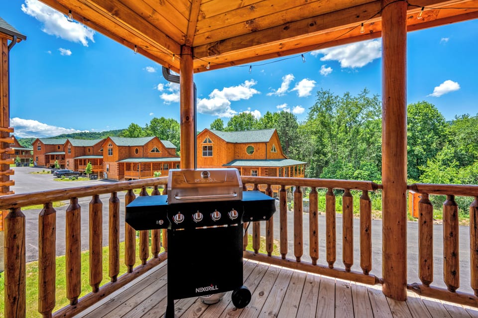 Balcony with Hot tub, 4 Rocking Chairs and One Comfort Chair.
Hot Tub can accommodate 7 people.
Patio has a Propane Grill and tank attached. 
Patio String Light turns on automatically after dark.