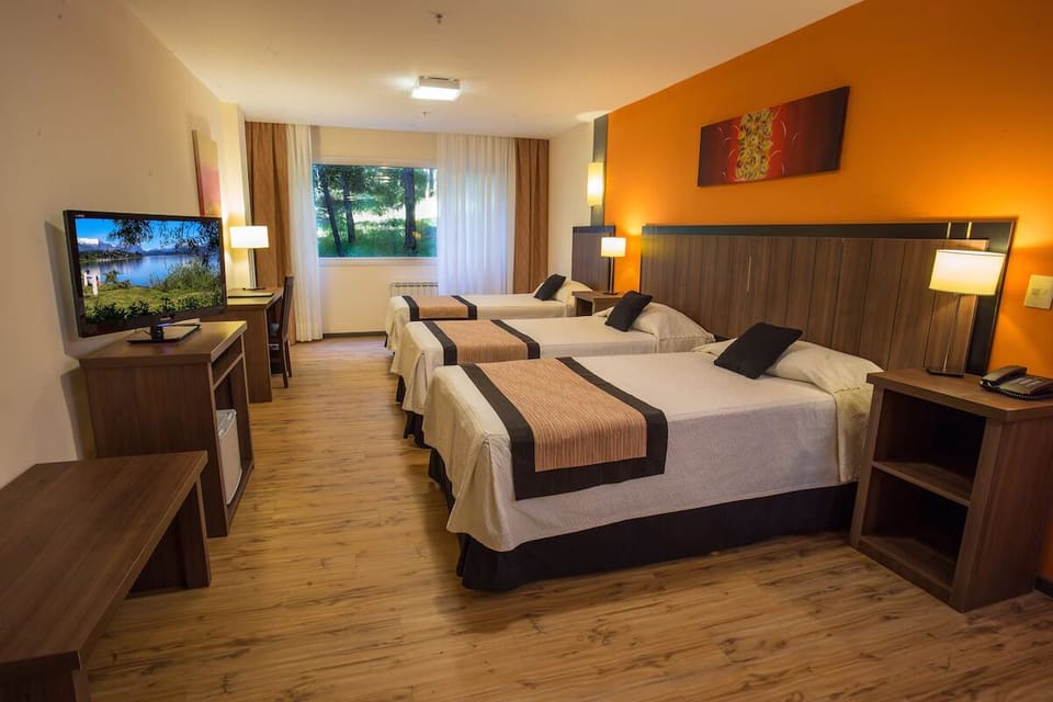 Gather comfortably in a spacious room with three inviting beds.