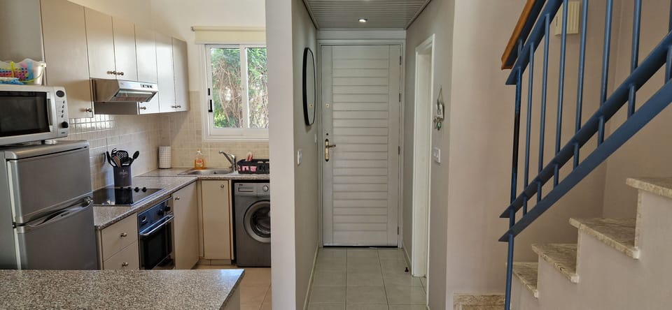 Front Door, Passage, Toilet And Kitchen Area