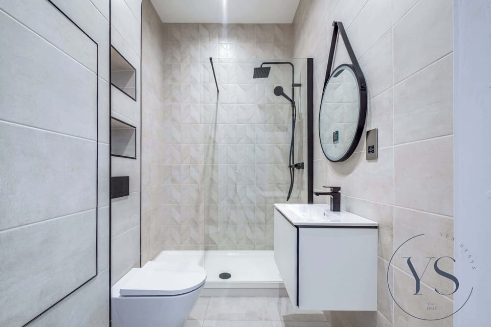 Luxurious bathroom with marble tiling, walk-in shower