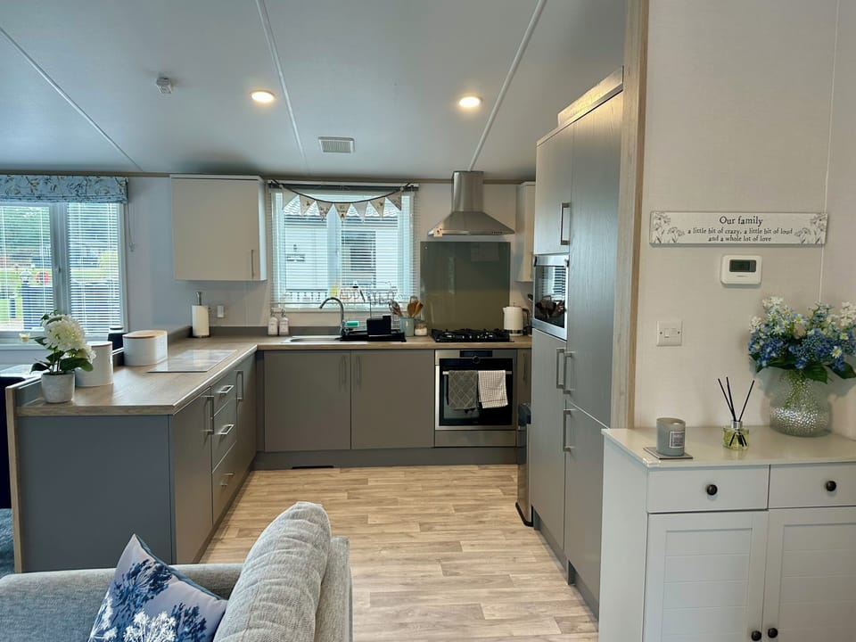 Kitchen area there is a separate utility room with washing machine & sink 