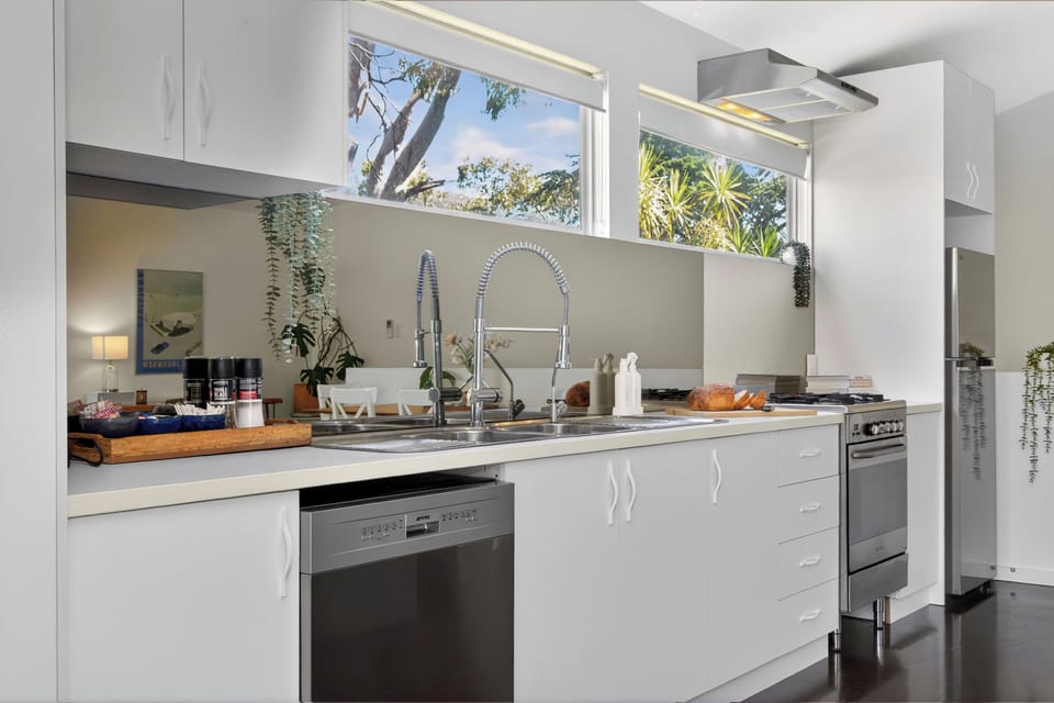 The kitchen features a gas cooktop, oven, dishwasher, and Nespresso machine—providing everything needed for effortless home cooking and slow morning rituals.