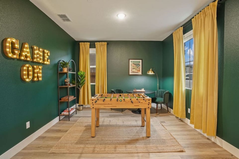 Fun vibrant game room with foosball table and chess board