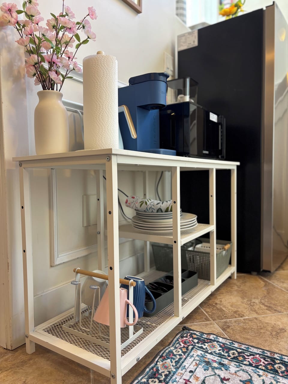 This compact yet fully equipped kitchenette brings luxury hotel convenience.