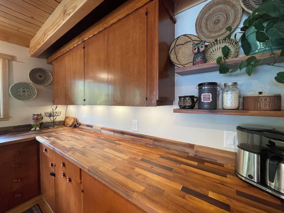 Gorgeous walnut butcher block countertops make you feel right in the woods.