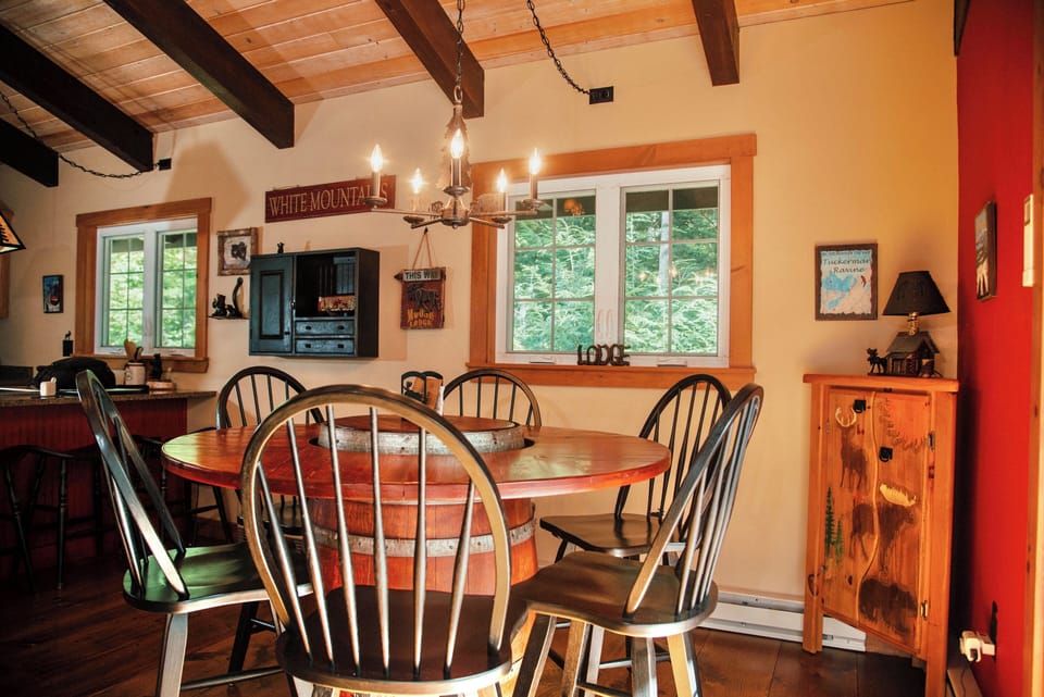 Our custom whiskey barrel dining table seats 6 comfortably.