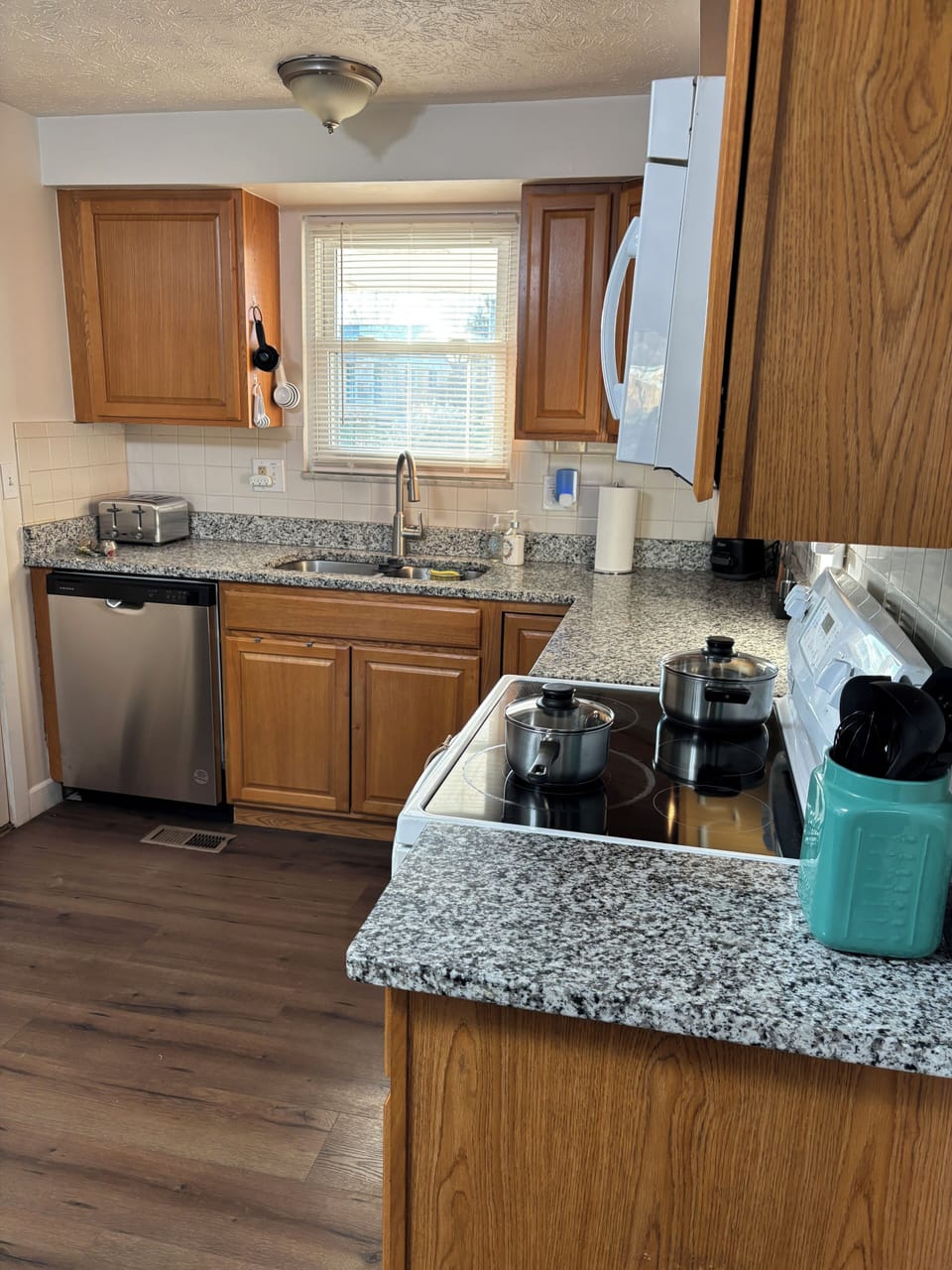 Kitchen with dishwasher, pots & pans to cook up something delicious.
