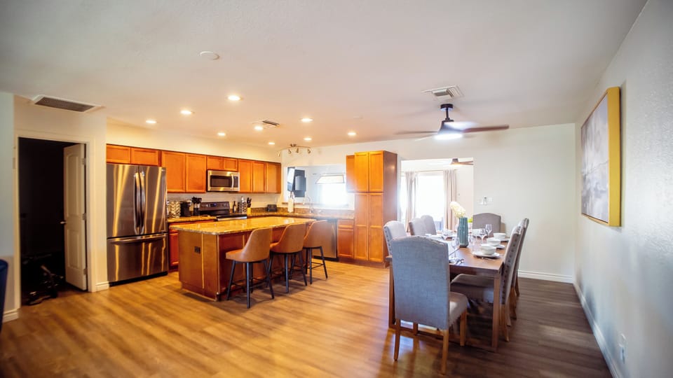 Seated dining for 11 people in kitchen and dining area