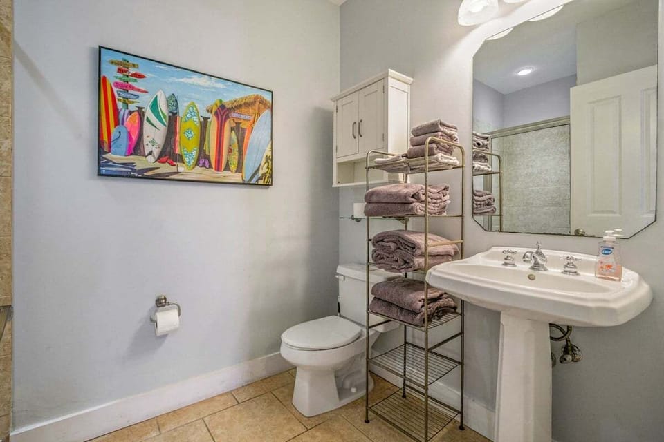 An attached en-suite bathroom of first floor double bunk room, complete with towels provided for extra convenience and comfort!