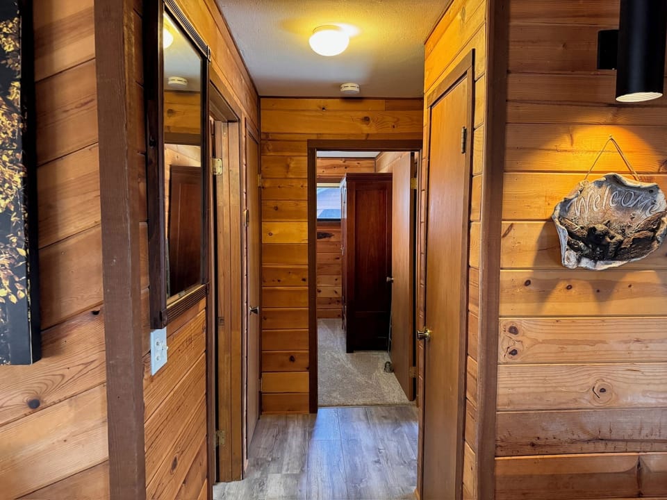 Hallway from the main living area to two bedrooms and shared bathroom