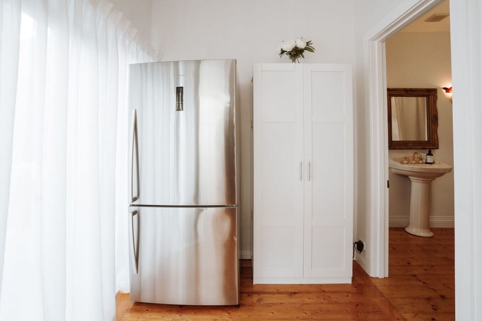 Full-size refrigerator and freezer with ice maker and water filter.