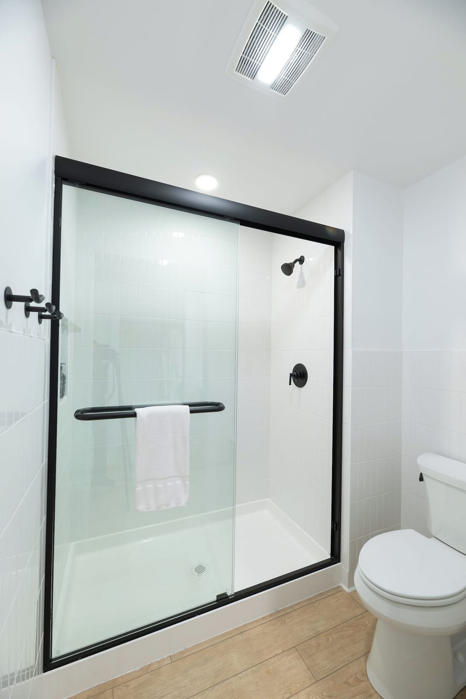 Rinse off in a bright, glass-enclosed shower after adventures.