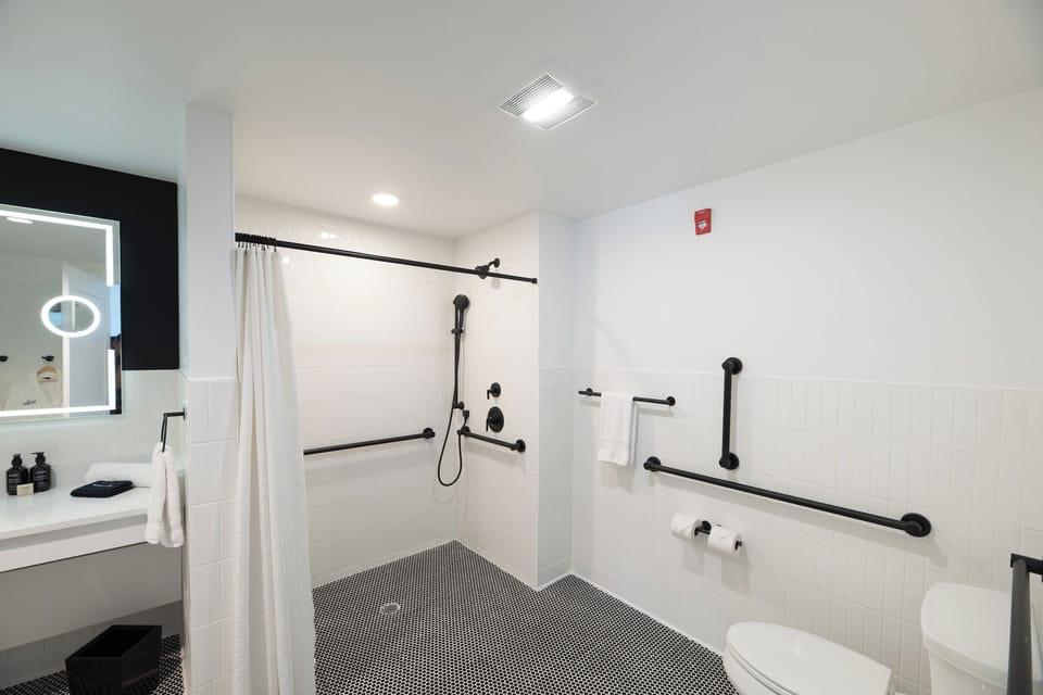 Enjoy an easy, accessible bathroom layout with supportive grab bars.