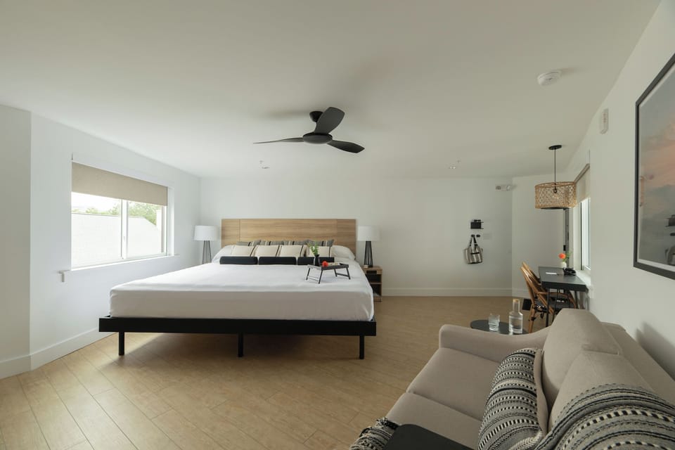 Unwind in a bright, airy suite with calming minimal design.