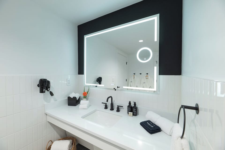 Refresh each morning at a sparkling vanity with glowing mirror.