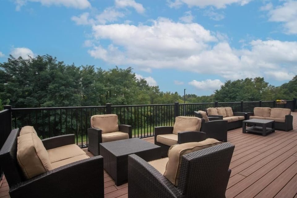 Lounge outdoors with coffee and fresh air on the expansive deck.