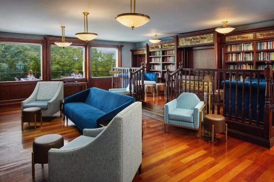 Settle into plush seating beside warm woodwork and wide windows.