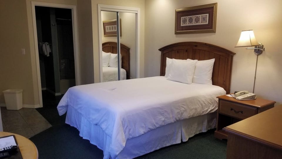 Unwind in crisp linens and soft bedside lighting.