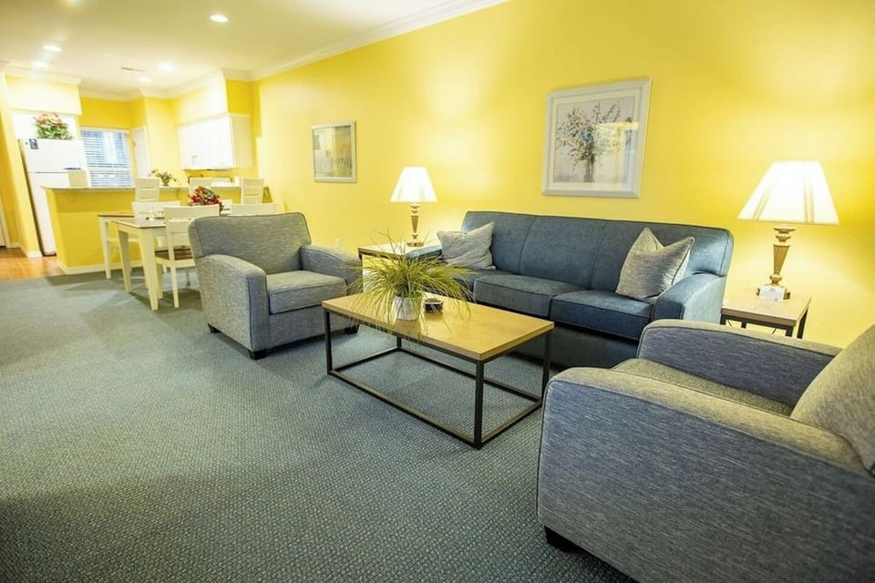 Gather in the sunny living room for relaxed conversation.