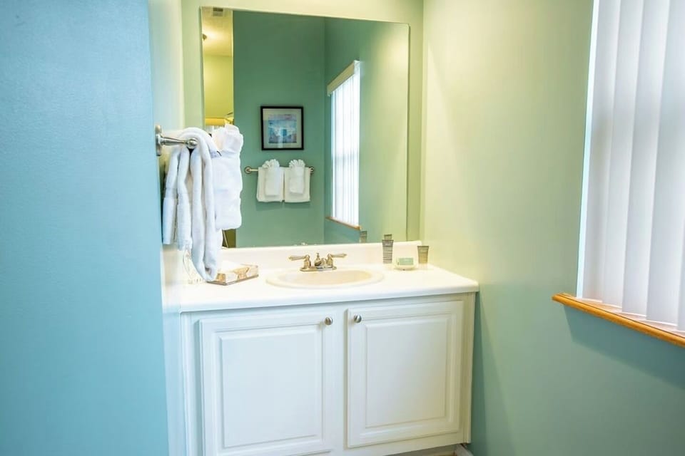 Refresh at the spacious vanity with fluffy towels ready.