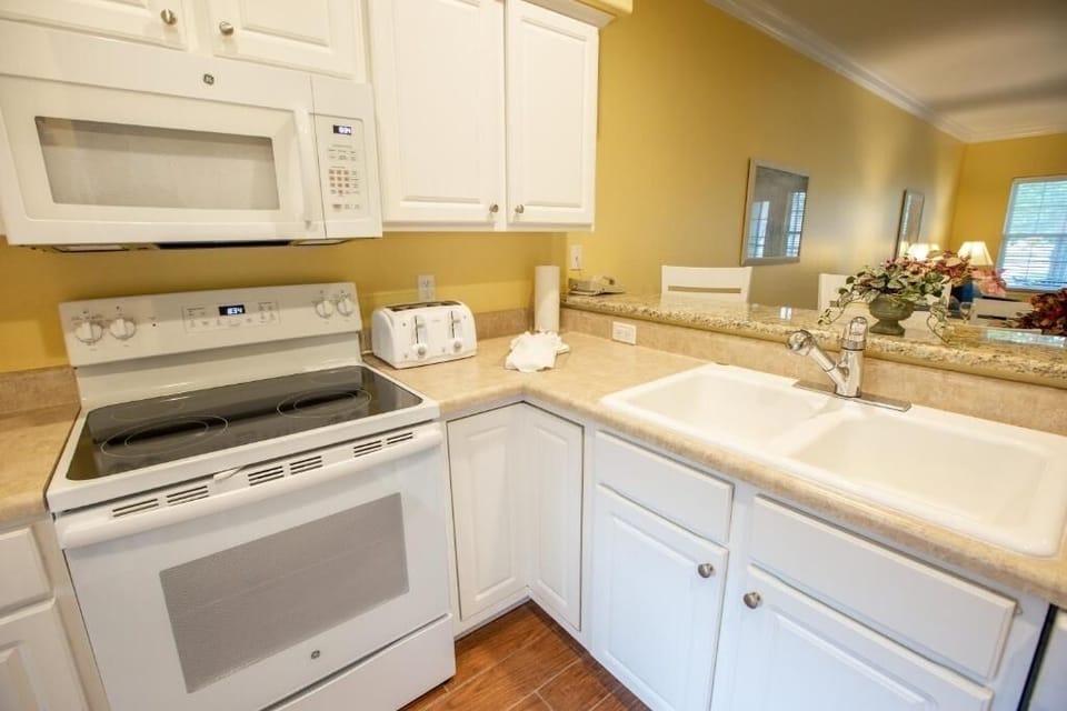 Cook easy breakfasts with full stove, microwave, and roomy counters.