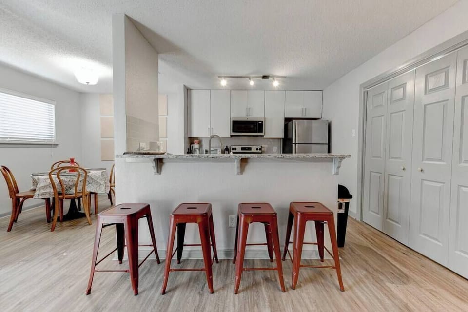 Breakfast bar seating ideal for quick bites or morning coffee together.