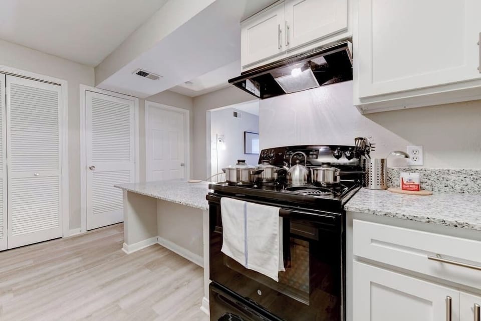 Close-up of the kitchen showcasing stove and cabinetry