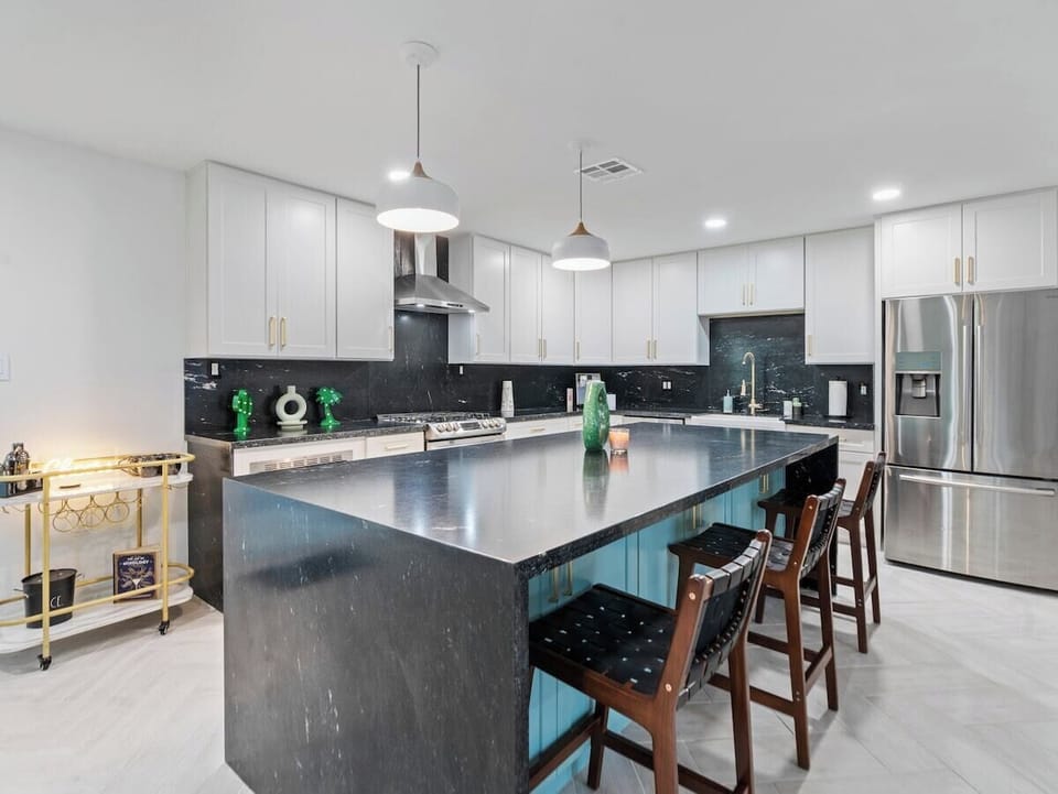 With ample seating and a stylish ambiance, this space is perfect for enjoying home-cooked meals or takeout from local eateries.