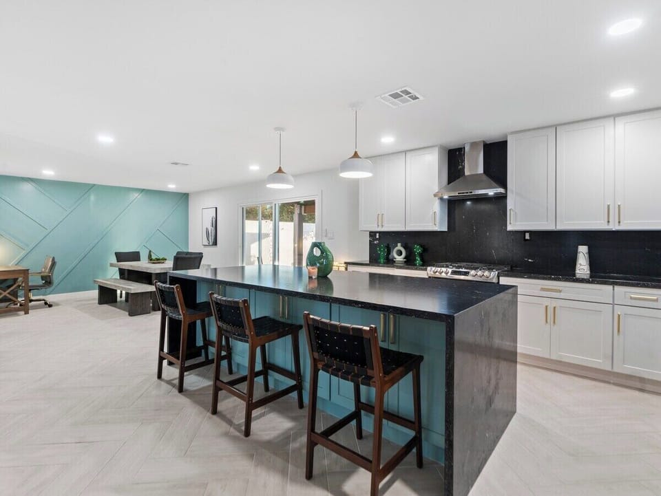 With ample seating and a stylish ambiance, this space is perfect for enjoying home-cooked meals or takeout from local eateries.