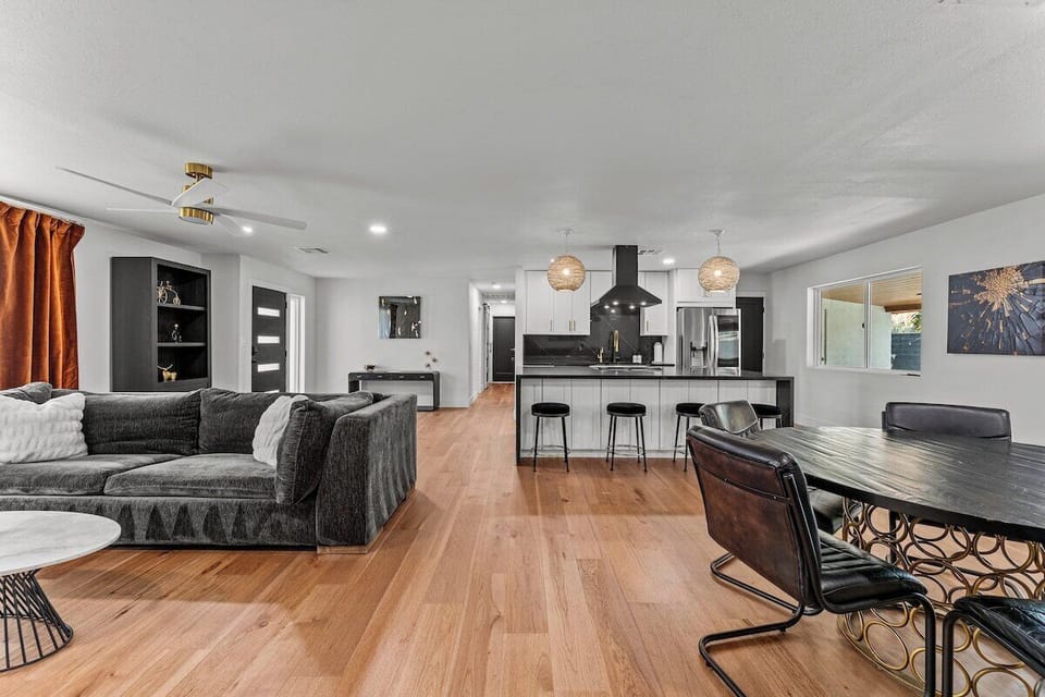 Welcome to the heart of our stylish retreat! Our living room exudes comfort and modern charm, featuring plush furnishings and contemporary decor.