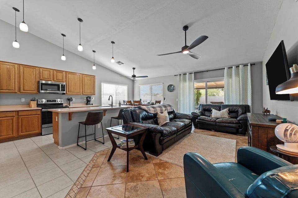 Welcome to the heart of our stylish retreat! Our living room exudes comfort and modern charm, featuring plush furnishings and contemporary decor.