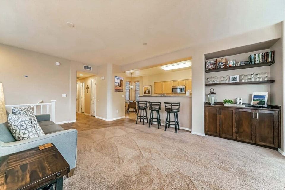 Welcome to the heart of our stylish retreat! Our living room exudes comfort and modern charm, featuring plush furnishings and contemporary decor.