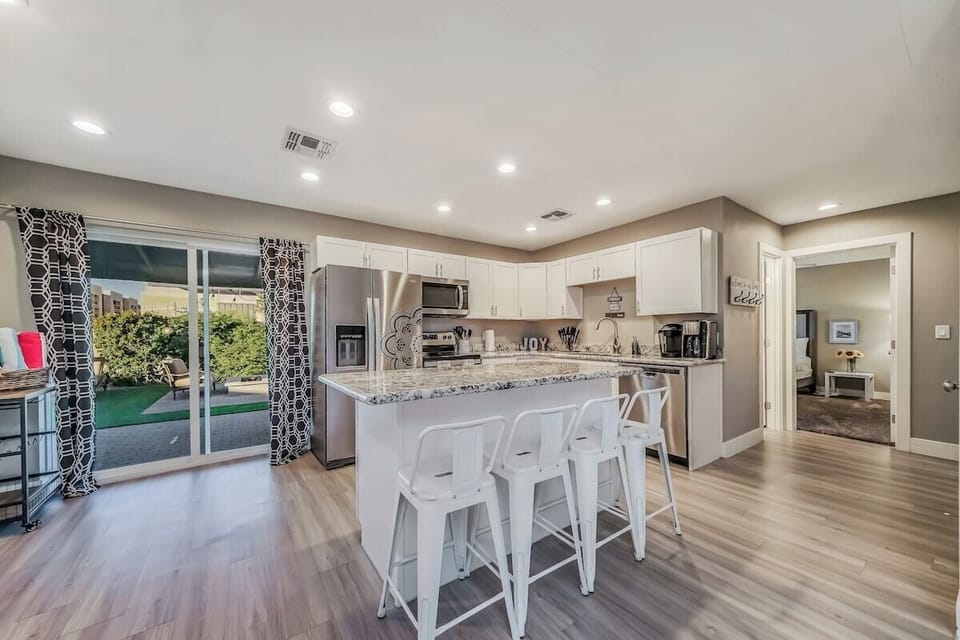 With ample seating and a stylish ambiance, this space is perfect for enjoying home-cooked meals or takeout from local eateries.