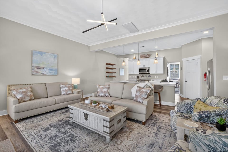 Living area and Open concept, fully stocked kitchen at the back