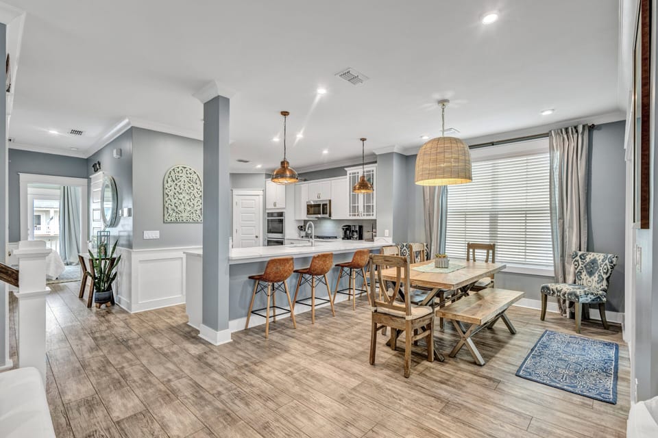 Open concept layout with natural light and screened in porch access