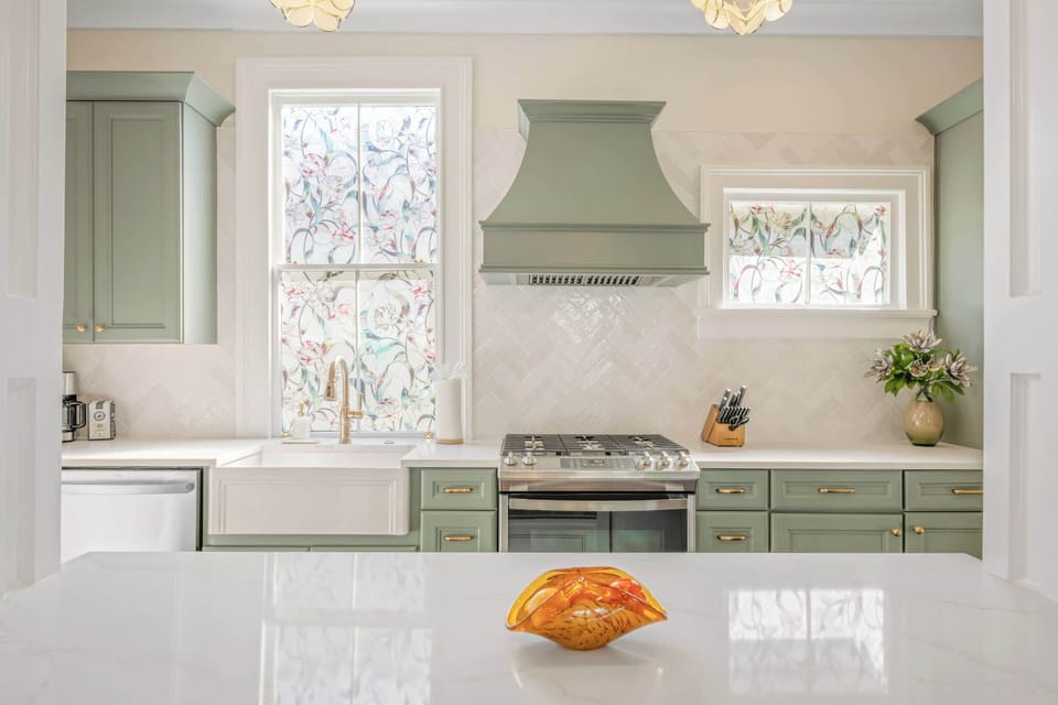 Kitchen with large island open to the living room.