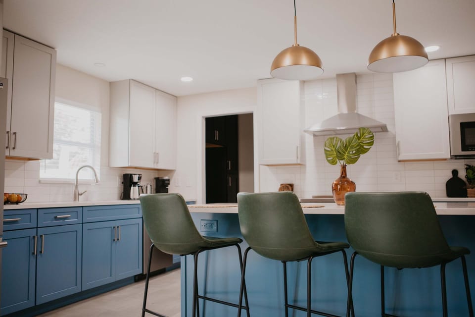 Our fully stocked kitchen features high-end appliances and a large island with high seating — perfect for cooking up feasts, sipping morning coffee, or sharing laughs while you prep meals.

